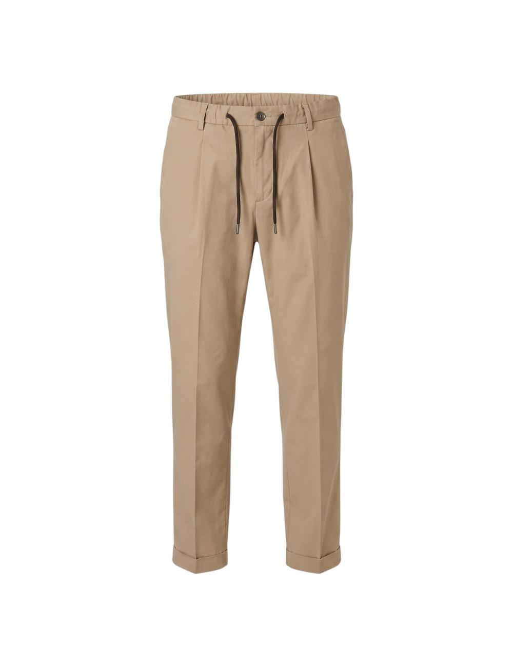 Beige trousers outfit with...