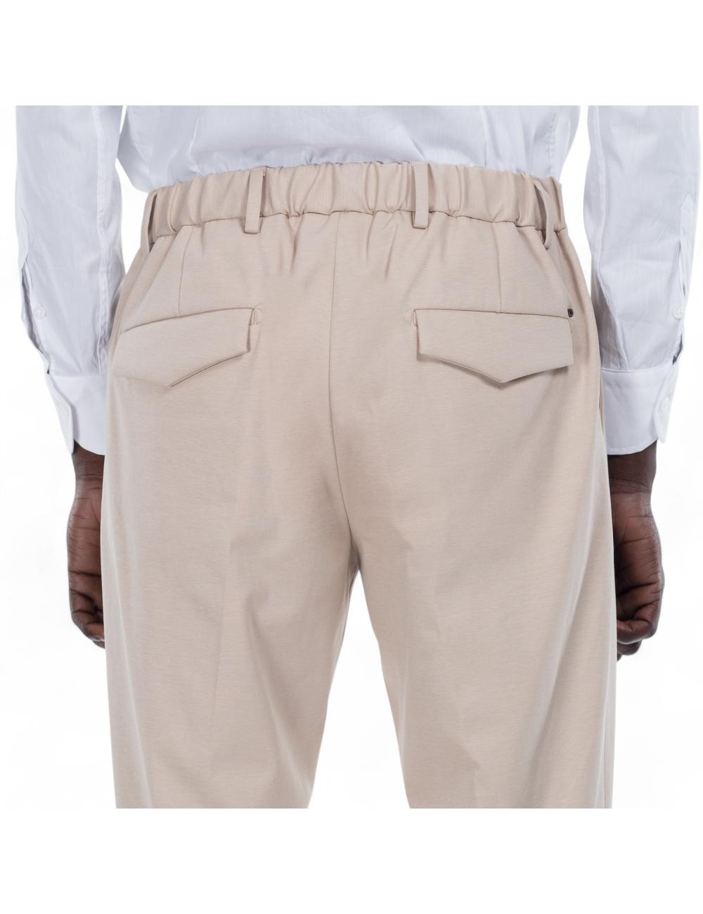 Beige trousers outfit with...