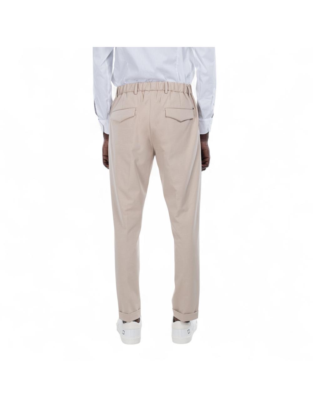 Beige trousers outfit with...