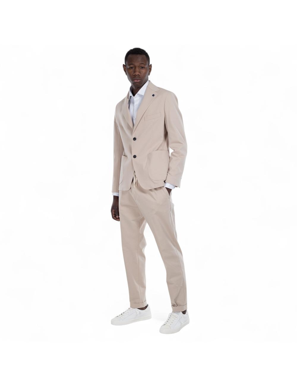 Beige trousers outfit with...